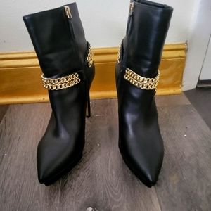 JLo black and gold booties